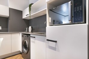 Enjoy cooking in this kitchen with an oven, microwave, and dishwasher.