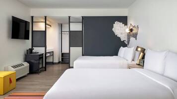 Hypo-allergenic bedding, desk, laptop workspace, blackout curtains