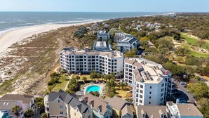 A coastal hotel with multiple buildings, a swimming pool, and a beach view. - Summer House 109 - 30 Seconds to Sand! (Isle of Palms)