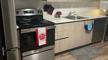 Microwave, stovetop, dishwasher, cookware/dishes/utensils