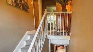 A staircase with a white railing leading to a landing. - 2 bedroom accommodation in Gargrave, near Skipton (Skipton)