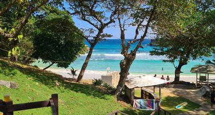 Charming 2-Bedroom Retreat with AC, Sea & Mountain Views, Steps from Downtown!