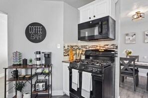 Enjoy meals in the kitchen with a coffee station and convenient wall-mounted appliances.