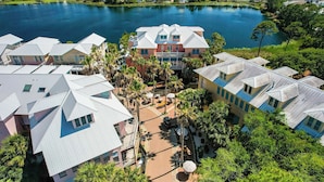 A residential area with multiple houses, a central courtyard, and a lake.
