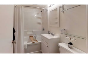 Combined shower/bathtub, hair dryer, towels, soap
