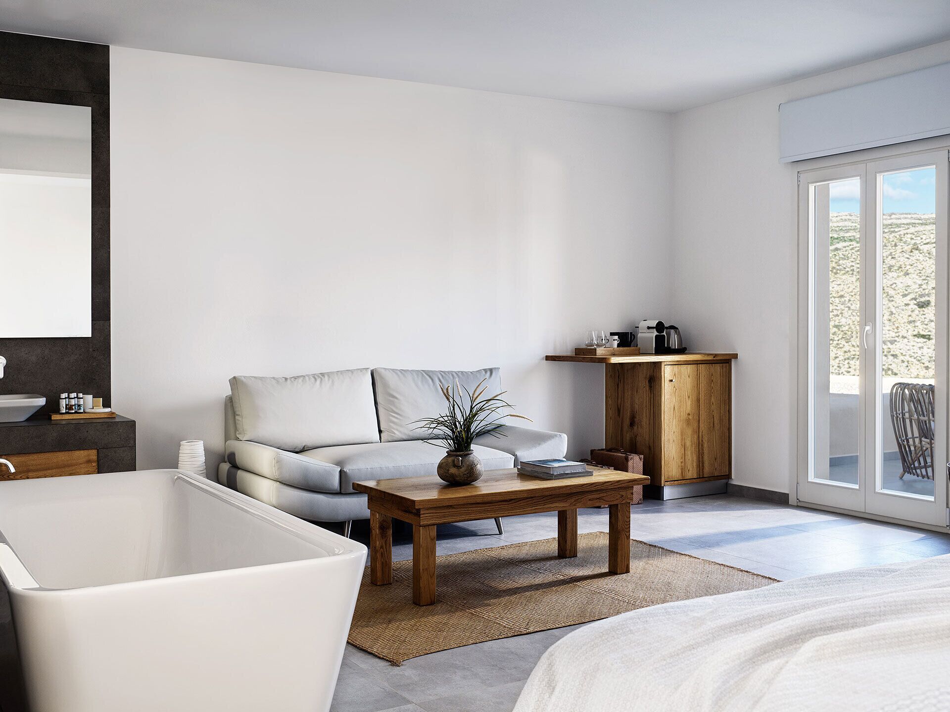 A modern bedroom with a large bed, a wooden nightstand, a sofa, a coffee table, and a view of the outdoors through a sliding door.
