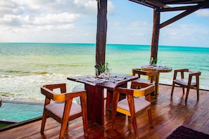 Enjoy dining on the deck with a clear view of the sea.