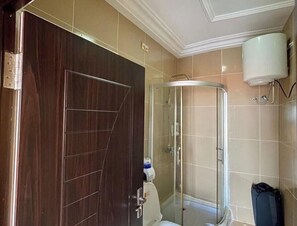 Shower, hair dryer, towels, toilet paper