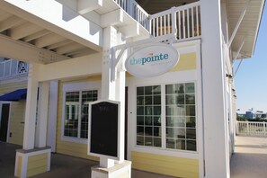 Enjoy a meal at The Pointe Restaurant & Bar, overlooking the surrounding area from the large window with a grid pattern.