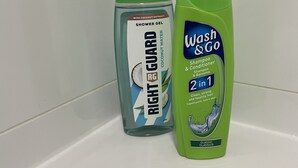 Two bottles of personal care products on a white surface. - Modern city centre two bedroom fully equipped apartment (Derby)