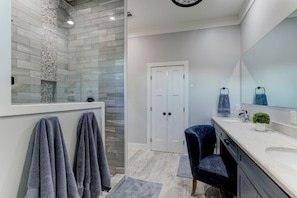 Combined shower/tub, hair dryer, towels, soap