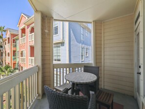 Enjoy a peaceful retreat with a balcony offering a view of the surrounding neighborhood.
