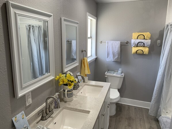 Combined shower/tub, hair dryer, towels, soap