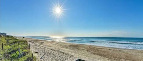On the beach, sun loungers, beach towels