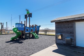 Guests can enjoy a playground area with a slide and climbing structure.