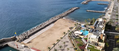 On the beach, sun-loungers, beach towels