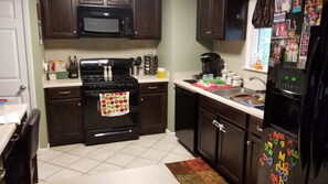Microwave, dishwasher, coffee/tea maker, cookware/dishes/utensils