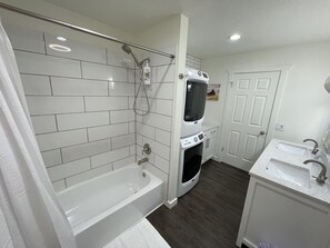 Combined shower/tub, hair dryer, towels, soap