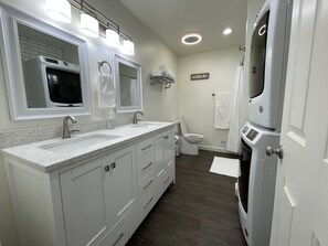 Combined shower/tub, hair dryer, towels, soap