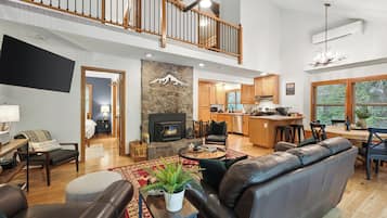 Smart TV, fireplace, books, computer monitors