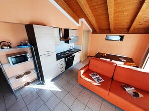 Enjoy a comfortable stay in this compact accommodation with a modern kitchen and cozy seating area.