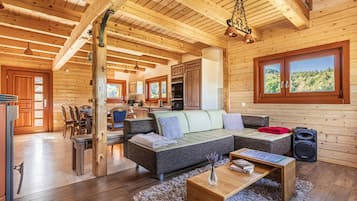 Family Chalet, Multiple Bedrooms, Mountainside (House Of Nature With Sauna And Tents) | Living area | 21-inch flat-screen TV with digital channels, TV, fireplace