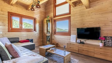 Family Chalet, 2 Bedrooms, Mountainside (House Of Nature With Sauna And Tents) | Living area | 21-inch flat-screen TV with digital channels, TV, fireplace