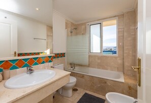 Bathtub, hair dryer, towels