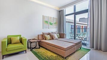 Family Apartment, Non Smoking, City View | Living area | 43-inch LED TV with cable channels
