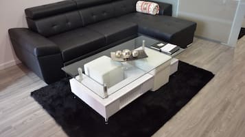 Deluxe Apartment, 1 King Bed with Sofa bed, Kitchen, Hill View | Living area | 32-inch flat-screen TV with cable channels, TV