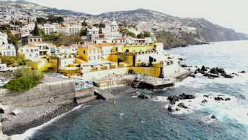 Beach nearby, black sand, sun loungers, beach umbrellas