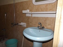 Standard Double Room | Bathroom | Shower, free toiletries, slippers, towels