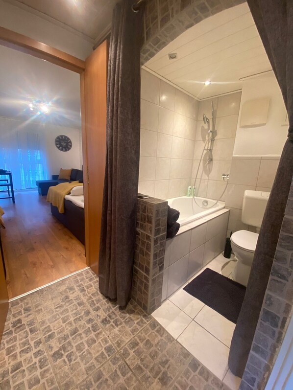 Combined shower/tub, hair dryer, towels, soap