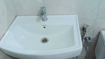 Combined shower/bathtub, towels, soap, toilet paper