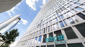 A modern hotel building with a prominent 'now Hotels' sign. - nhow Frankfurt (Frankfurt)