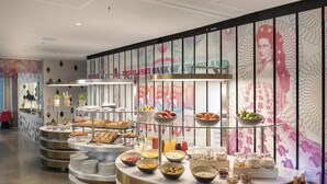 A breakfast buffet with various food items and beverages. - nhow Frankfurt (Frankfurt)