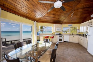 Bright and sunny kitchen fully equipped with an array of appliances such as a highly sophisticated coffee machine and panini, bread, rice and waffle makers.