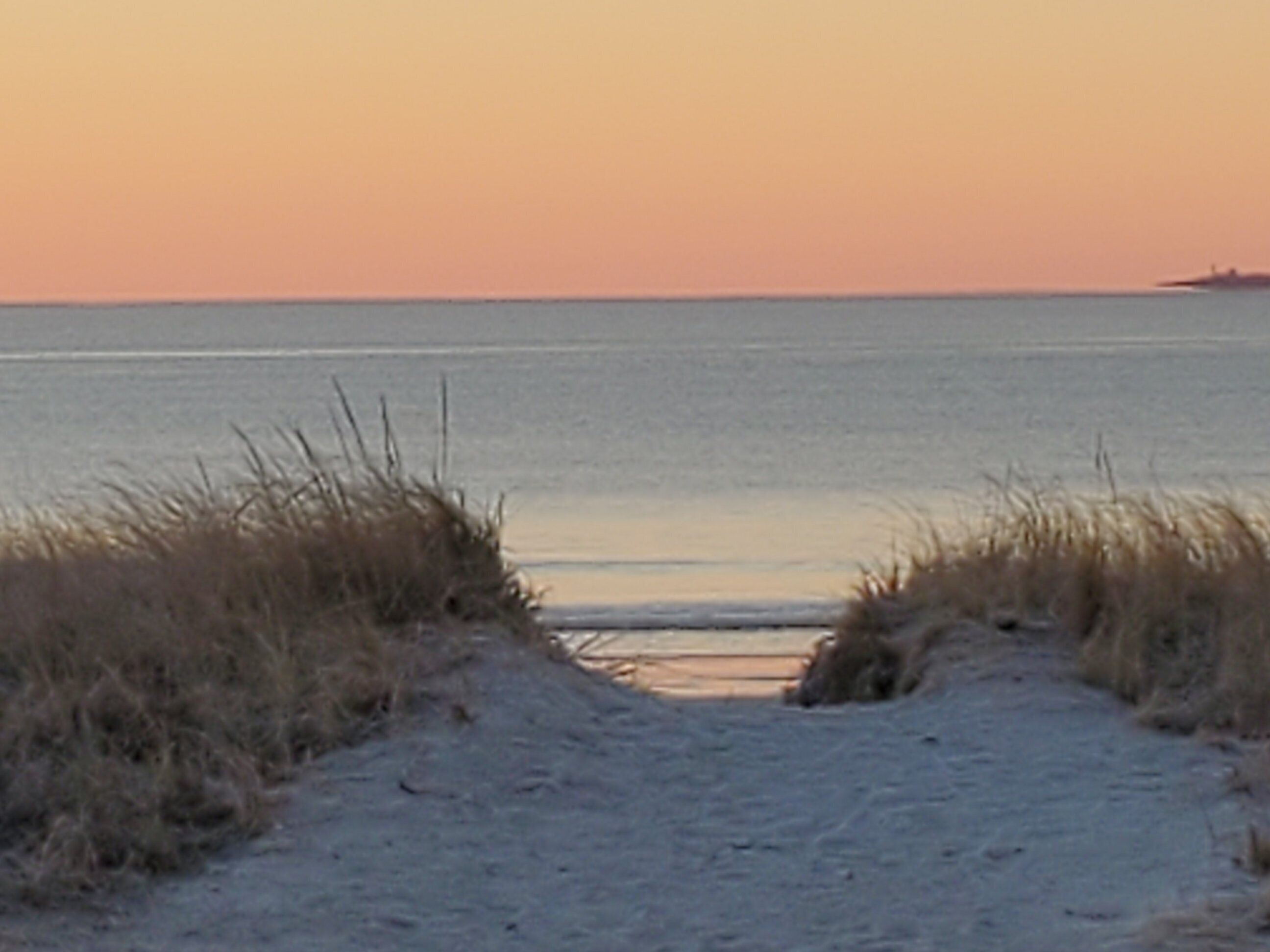 Steps away from the beautiful sands of Pine Point Beach, on a lovely salt marsh.
