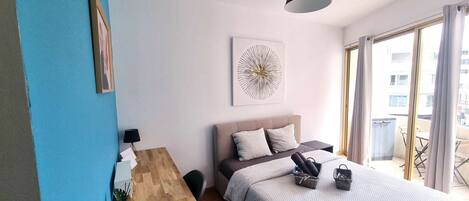 1 bedroom, desk, iron/ironing board, travel crib