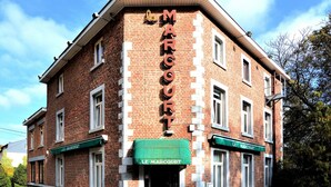 A brick building with the name "Le Marcourt" on the facade. - Holiday home in Marcourt with garden (Rendeux)