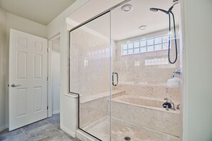 Combined shower/tub, hair dryer, towels, soap