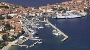 A coastal town with a marina, historic buildings, and a large cruise ship docked. - Holiday Home in Lumbarda with Garden (Lumbarda)