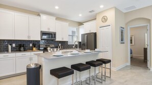 Villa, 5 Bedrooms | Private kitchen | Oven, dishwasher, dining tables - 1569 The Retreat at Champions Gate by Orlando Holiday Rental Homes (Davenport)