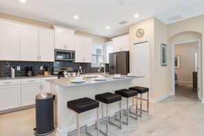 Villa, 6 Bedrooms | Private kitchen | Oven, dishwasher, dining tables - 1593 The Retreat at Champions Gate by Orlando Holiday Rental Homes (Davenport)