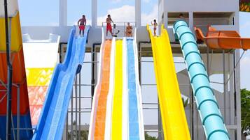 A water park with multiple slides in various colors.