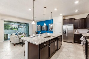 Townhome, 5 Bedrooms | Private kitchen | Oven, dishwasher - 7443 Solterra by Orlando Holiday Rental Homes (Davenport)