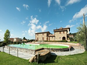 A stone building with a pool in front. - Apartment in Monte del Lago near Lake Trasimeno (Monte del Lago)