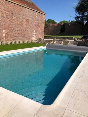 Seasonal outdoor pool, pool umbrellas, pool loungers