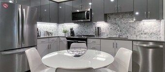 Pets Stay Free • Private Terrace • Elevator • King Beds • In-Unit W/D