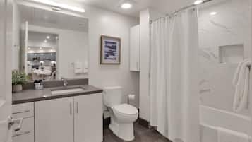 Combined shower/bathtub, hair dryer, towels, soap